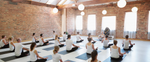Group meditation in well lit environment.