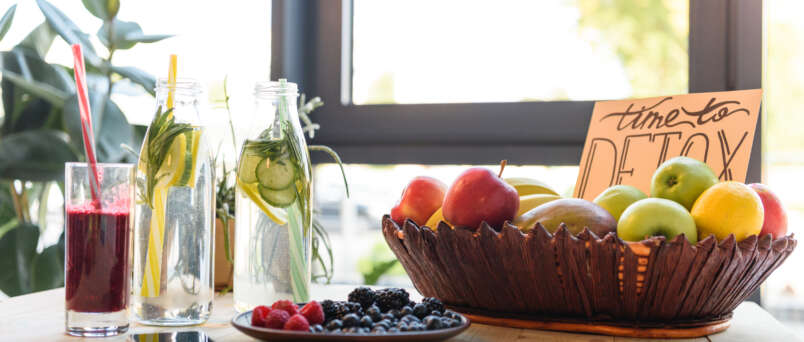 Assorted fresh fruits on a table, promoting natural detox and healthy living